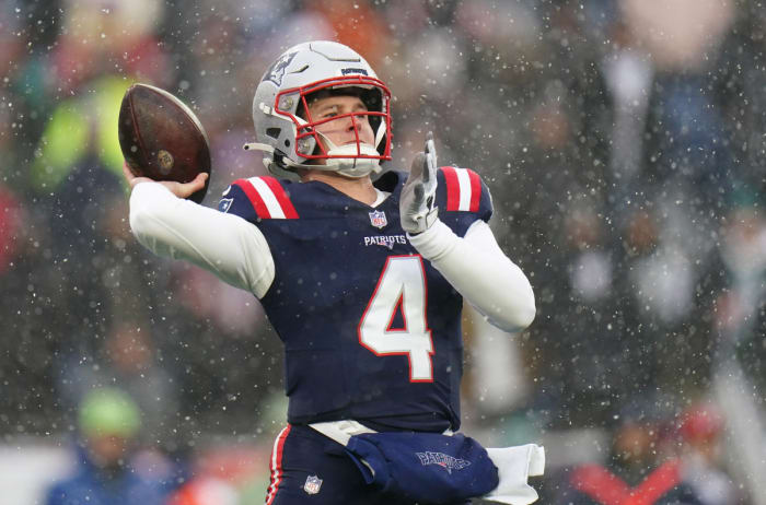 New England Patriots quarterback Bailey Zappe (4) throws a pass against the New York Jets in the first quarter at Gillette Stadium.